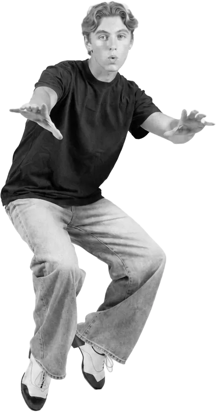 Dancer leaping with his arms stretched out
