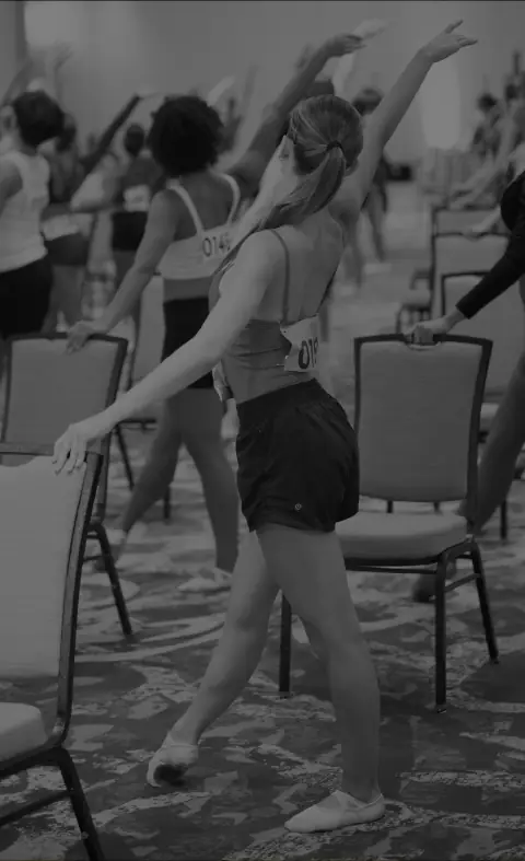 Dancers stretching in a DanceForward convention class