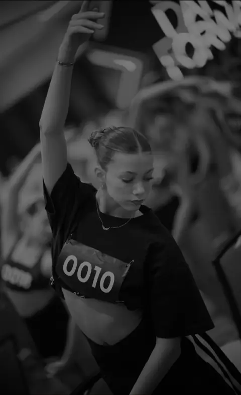A dancer reaching upward during a DanceForward audition