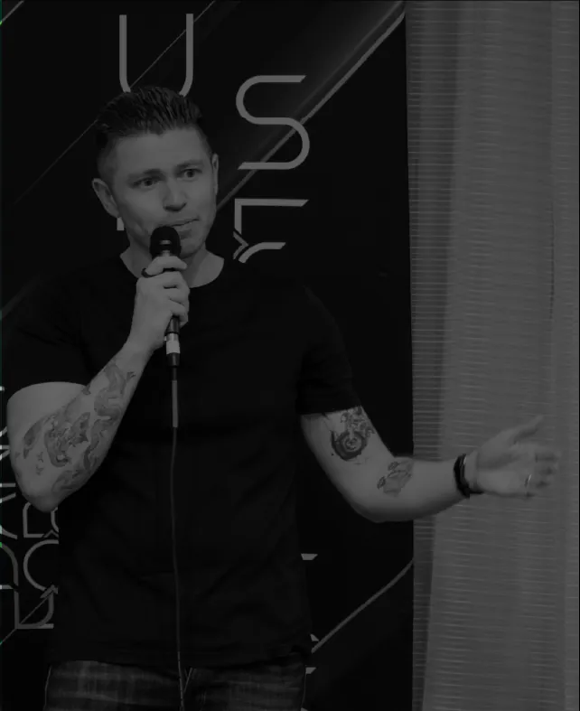 A DanceForward educator speaking into a microphone